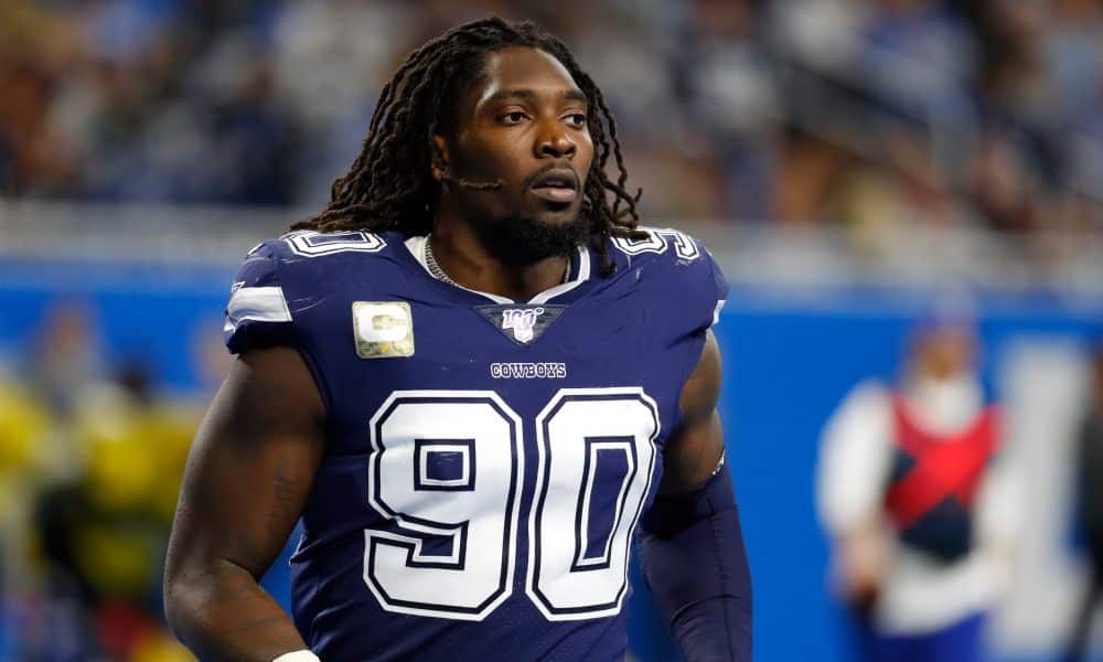 Dallas Cowboys defensive end Demarcus Lawrence runs onto the field before the second half of an NFL football game, Sunday, Nov. 17, 2019, in Detroit. (AP Photo/Paul Sancya)