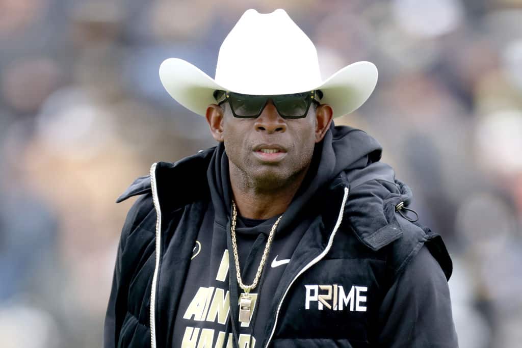 BOULDER, COLORADO - APRIL 22: Head coach Deion Sanders of the Colorado Buffaloes watches as his team warms up prior to their spring game at Folsom Field on April 22, 2023 in Boulder, Colorado. (Photo by Matthew Stockman/Getty Images)